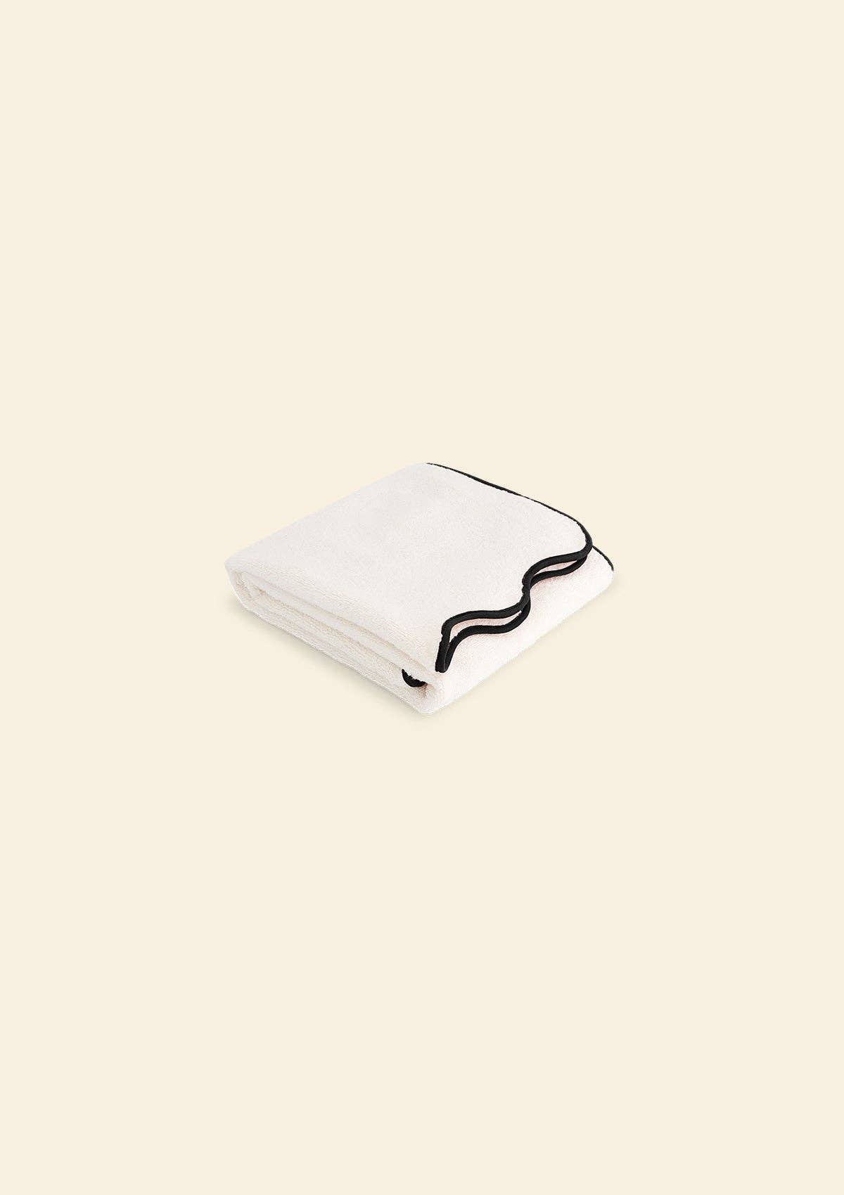 La serviette de bain ondulée en coton ivoire & noir